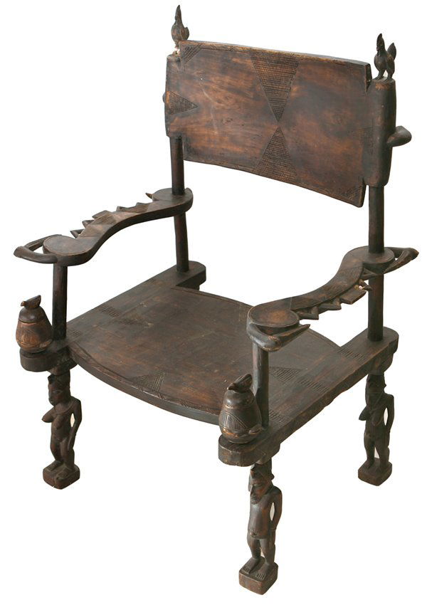 CARVED AFRICAN TRIBAL CHIEF'S CHAIR: With double headed birds as arms, full male and female figures for legs, cross hatched back and seat. Seat has carved wooden cups under each arm with bird finialed lids, and back posts have rooster fi