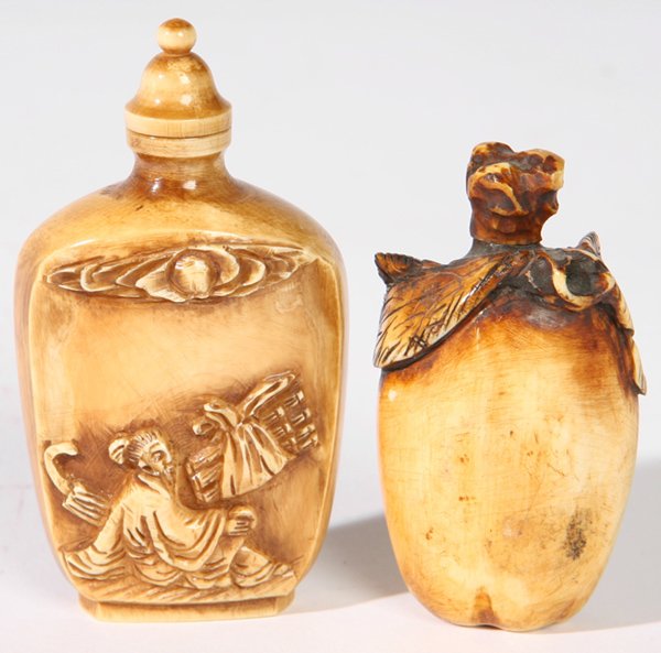 TWO CHINESE CARVED IVORY SNUFF BOTTLES: One fruit form, 2 1/2" h. and second with relief scene of peasant, 3" h. Both fine condition. THIS LOT CANNOT BE SHIPPED INTERNATIONALLY.