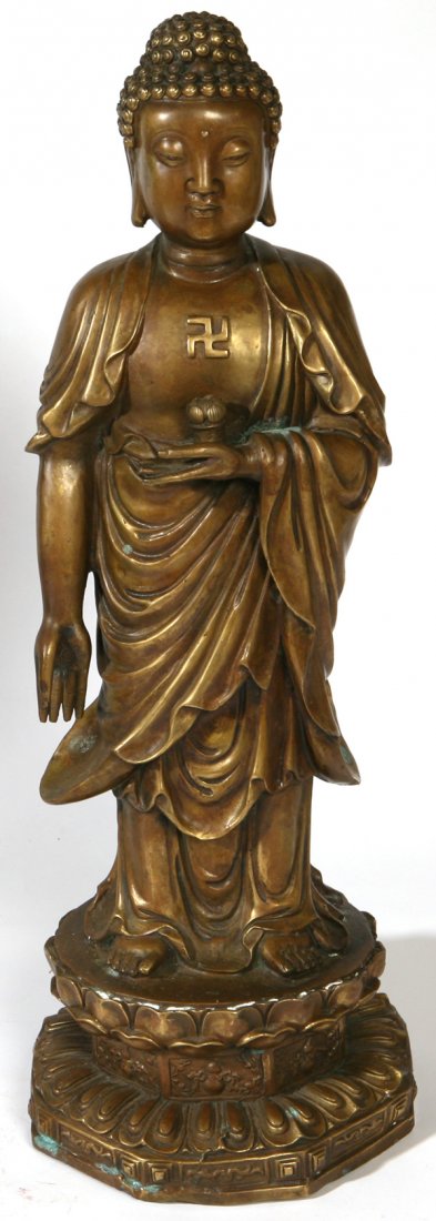 EARLY SIGNED CHINESE BRONZE STANDING BUDDHA: Holding lotus flower at chest with whirling log motif on bare chest, standing on stepped lotus base in nice old patina. Signed with artist cartouche on back. Possibly 19th Century. Minor oxidation pat