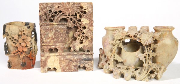 CHINESE STONE CARVINGS: Lot of three, all soapstone including a bookend with vase of flowers on stand, 6" h., plus triple urn with vining flowers, 6" x 4" h., and flower carved vase, 4" h. Last broken and glued, second with 