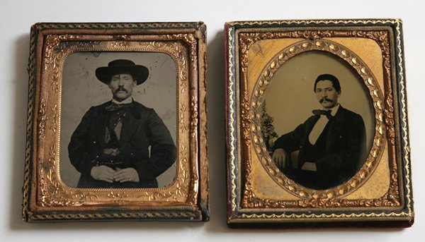 TWO AMBROTYPES OF WESTERN GENTLEMEN: Both are 6th plates in half cases. One is seated at table with arm resting on it and appears to Hispanic, the other has broad brimmed cowboy type hat.