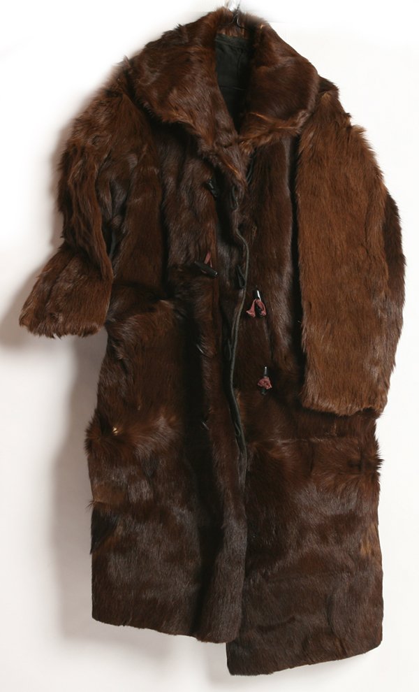 RARE INDIAN WARS BEARSKIN ARMY COAT: This wonderful brown bear skin coat with black cotton liner has wooden toggle type buttons and is 50” long, still quite supple.