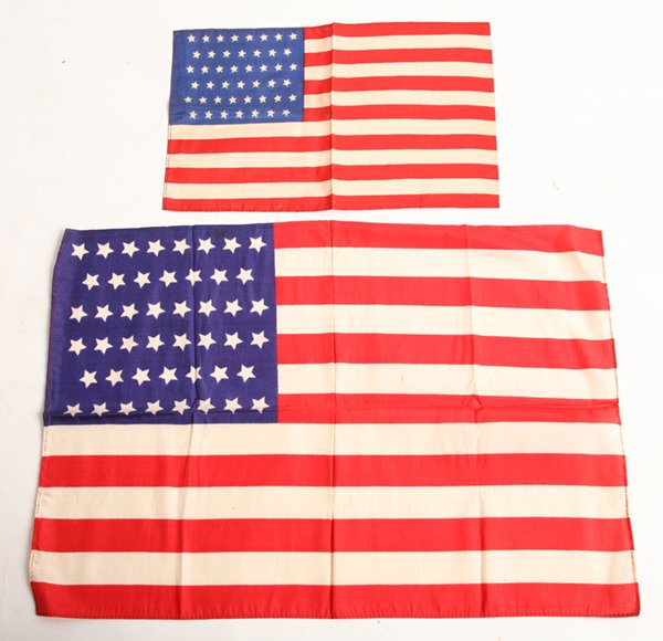 45 & 46 STAR PRINTED SILK PARADE FLAGS: Includes a 45 star with canton pattern of 8-7-8-7-8-7, 6.5” x 10.5”; 2nd 46 star with canton pattern is 8-7-8-8-7-8, 11.5” x 16.5”.