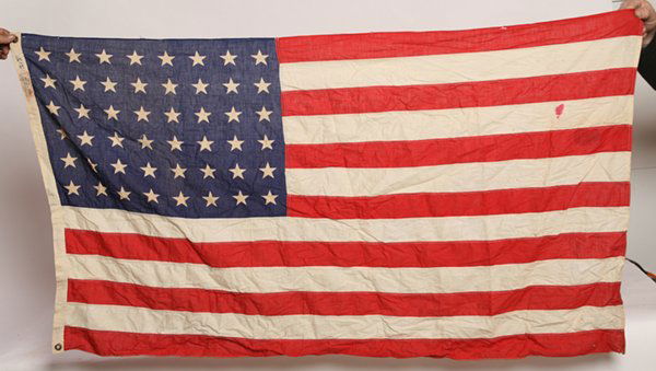 TWO U.S. FLAGS, 48 & 50 STAR: Both cotton with printed cantons, 1st canton pattern is 8-8-8-8-8-8 with sewn stripes and canvas hoist with 2 brass grommets, stamped on hoist “Stantest Bunting Flag 3x5 Ft”, 32” x 58”. 2nd ca