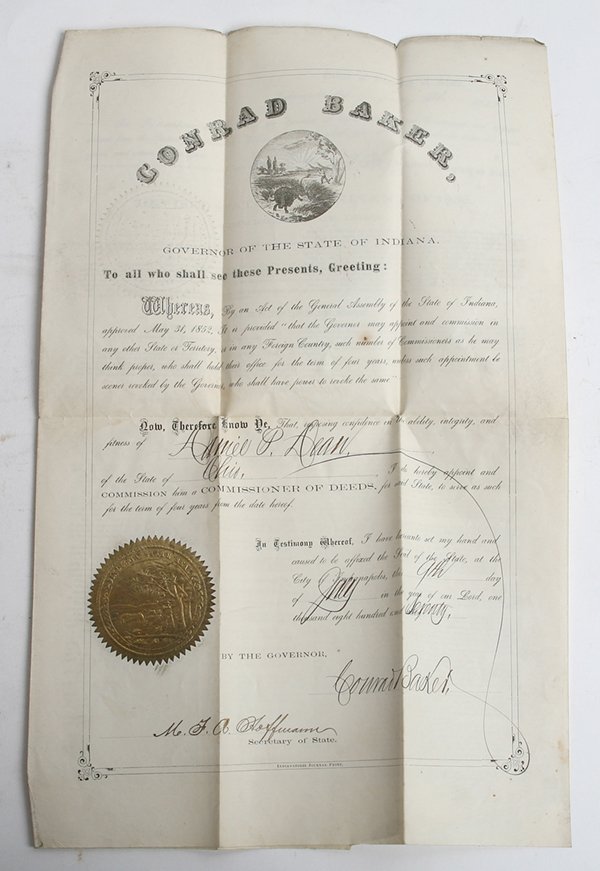 INDIANA GOV. CONRAD BAKER SIGNED DOCUMENT: Two page partially printed with gold foil seal of the State of Indiana, appointing D.P. Dean Commissioner of Deeds, dated May 31, 1852 and signed by Gov. Baker and Sect. of State Hoffmann.