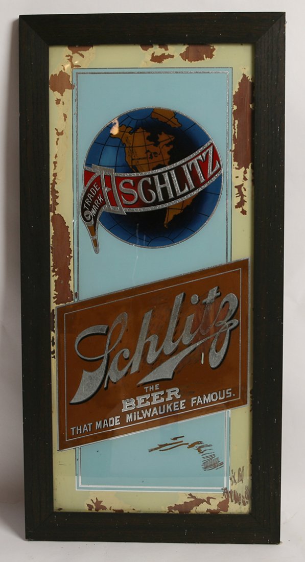 SCHLITZ BEER REVERSE PAINTED FRAME SIGN: In original oak frame with polychrome painted reverse painting of world logo with “Trade Mark Schlitz” and below “Schlitz the Beer That made Milwaukee Famous..”17.5” x 35.5”.