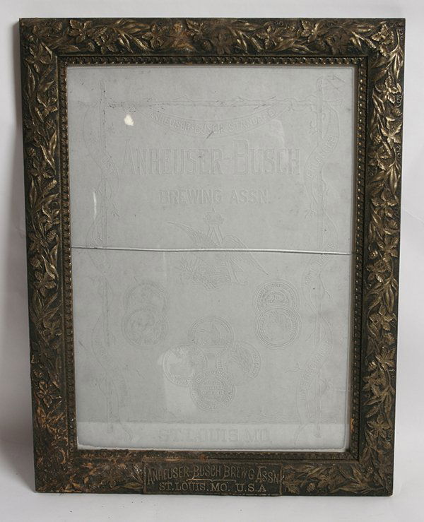 ETCHED GLASS ANHEUSER BUSCH BEER SIGN IN FRAME: With the company logo of eagle and “A” with price medals and ribbon banners, mounted in its original frame with embossed “Anheuser Bush Brew’g Ass’n St. Louis, Mo. U.S.A.” along bottom mar