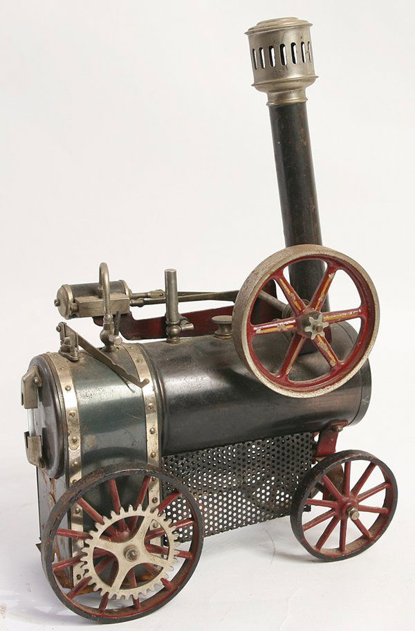 DC GERMAN STEAM ENGINE: In the form of an early locomotive, in tin, nickeled brass and cast iron8.5” x 4” x 12” high.