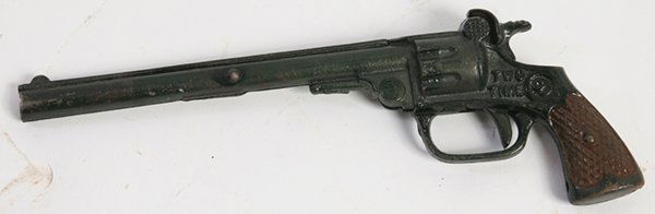 TWO TIME CAST IRON CAP PISTOL: Marked as above and “Pat. Sept. 11-23” in original green and brown painted finish, with “S” & “W” in circle on grips, 9” long.