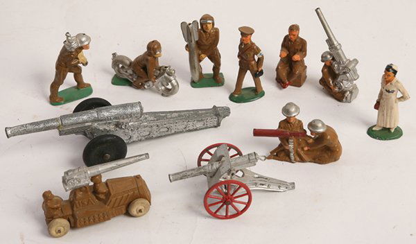 11 LEAD TOY SOLDIERS & CANNONS: All in original paint, includes one marked “Manoil No. 52” motorcyclist, 3” long; plus machine gun team, anti-aircraft gunner, 3 different cannons and others.