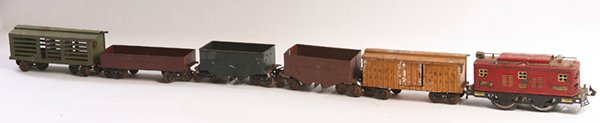 LIONEL O GAUGE ENGINE & FIVE CARS: All in original painted finish, includes locomotive No. 8, 12” long; plus yellow box car with “CM & St P 98237”, 9.5”; plus Pennsylvania coal car, 9.5”; plus one red and one green N.Y.H. & H