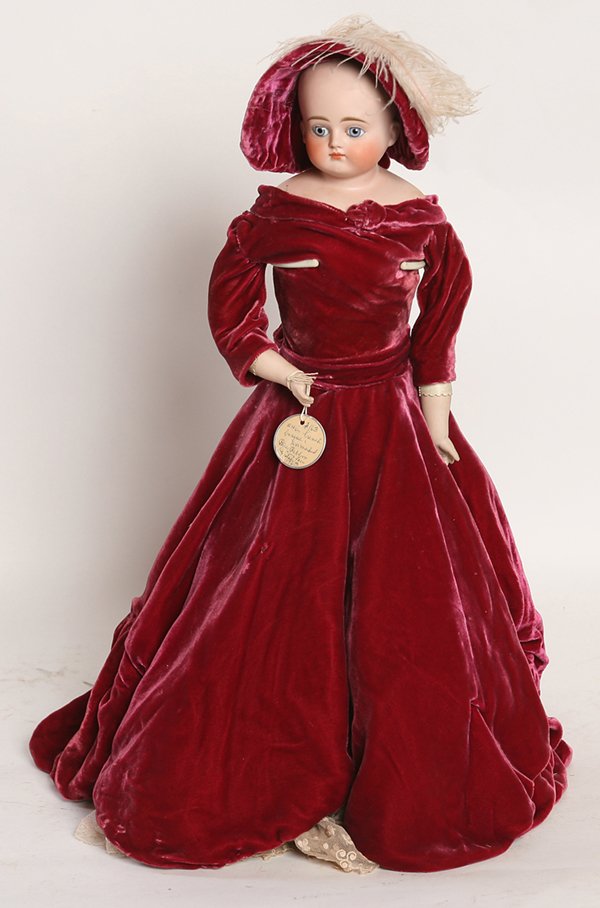 RARE KESTNER BISQUE CLOSED MOUTH FASHION DOLL: Shoulder head marked on back of head & plate “H1/2” with fixed blue glass eyes, on fashion kid body with bisque lower arms, red velvet outfit and hat, period undergarments, and period shoes with s