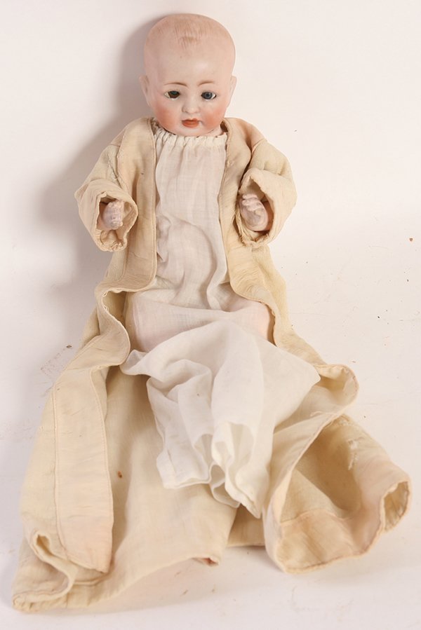 HERTEL, SCHWAB & CO. 151 BISQUE BENT LIMB BABY DOLL: Socket head marked on back of head “Made in Germany 151/7” with sleep blue glass eyes, open mouth domed head with painted hair, on 5 piece composition body in period white gown, 11” tall.