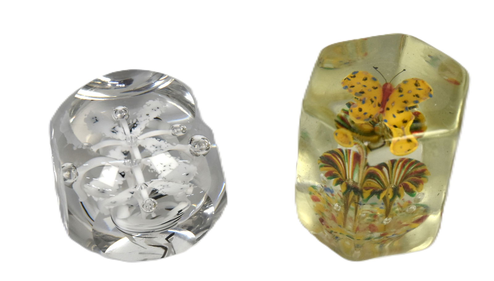Two Art Glass Paperweights: Including hexagonal example with polychrome butterfly above flower, ground and polished pontil, 2.75" dimeter & high; and black and white swirled flower with air trap and cut facits, ground and polish