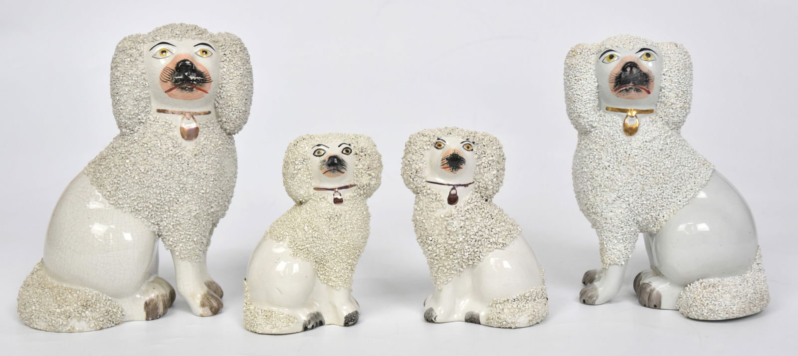 Two Pair of Old Staffordshire Dogs: First pair 7 1/4" H. Second pair 4 1/2" H. Both in good condition.