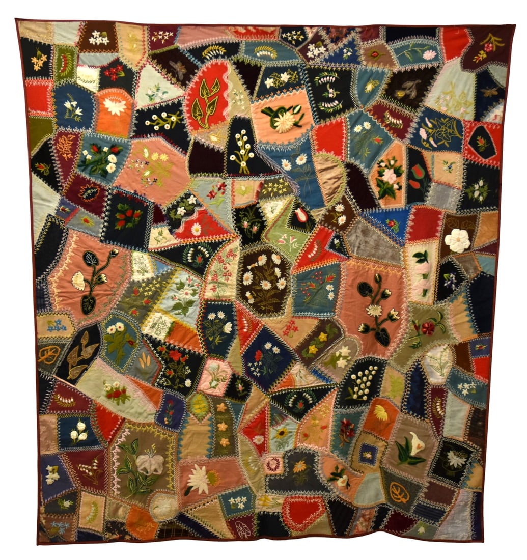 Wonderful Kentucky Crazy Quilt: with card of history of quilt which reads, "Made by Marguerite Boughner, Great Aunt to Sue Wehmeyer. The flowers represent those grown in her own flower garden." Over the years it was exhibited in the