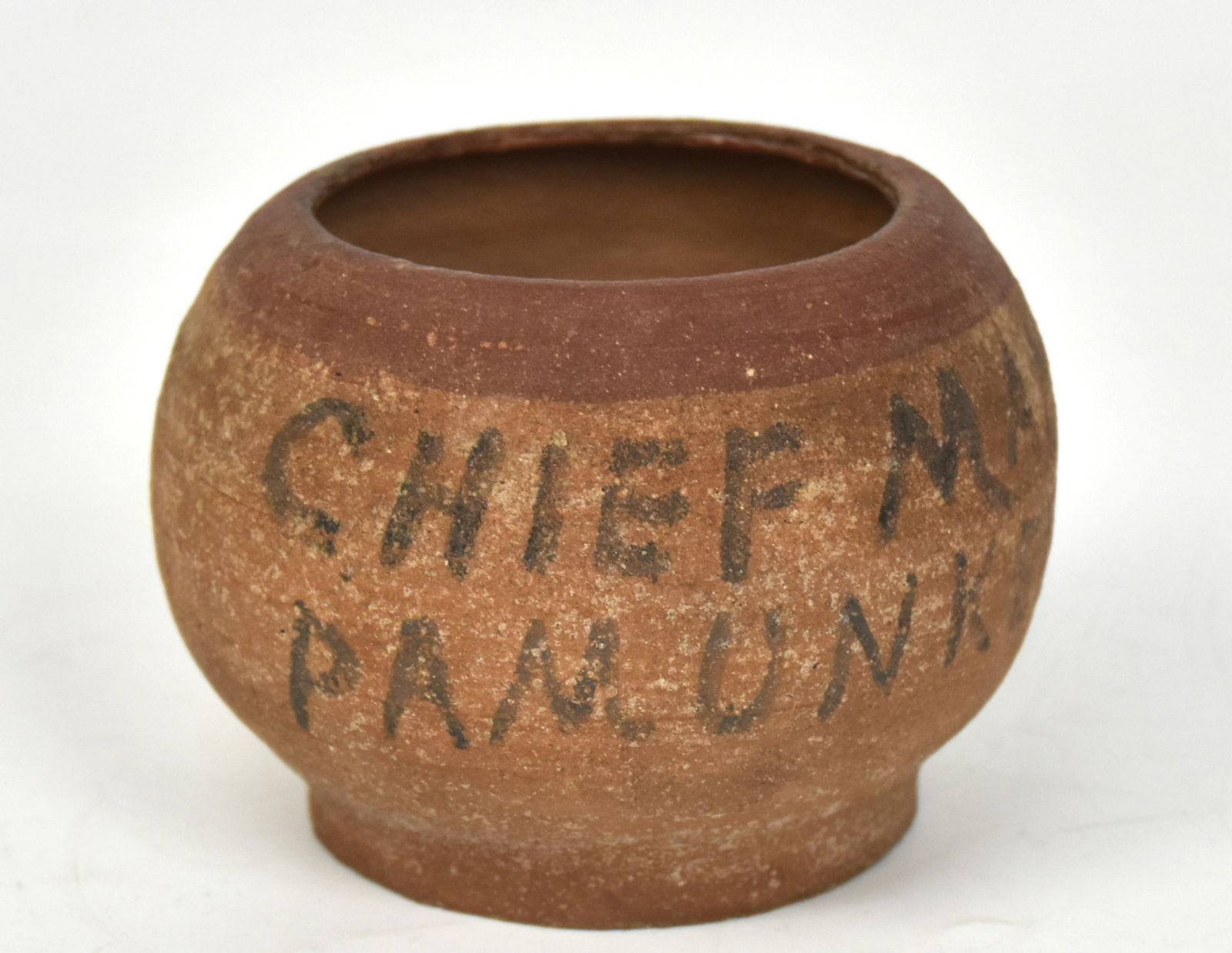 Signed Pamunkey Tribe Pottery Bowl: Buff stoneware bowl with red painted bands ad black inscription on side reading: Chief Manatawopp/Pamunkey Indian Res., and engraved on base Chief Miles, 3 3/4" diameter x 2 3/4" high. Pamunkey Reserv
