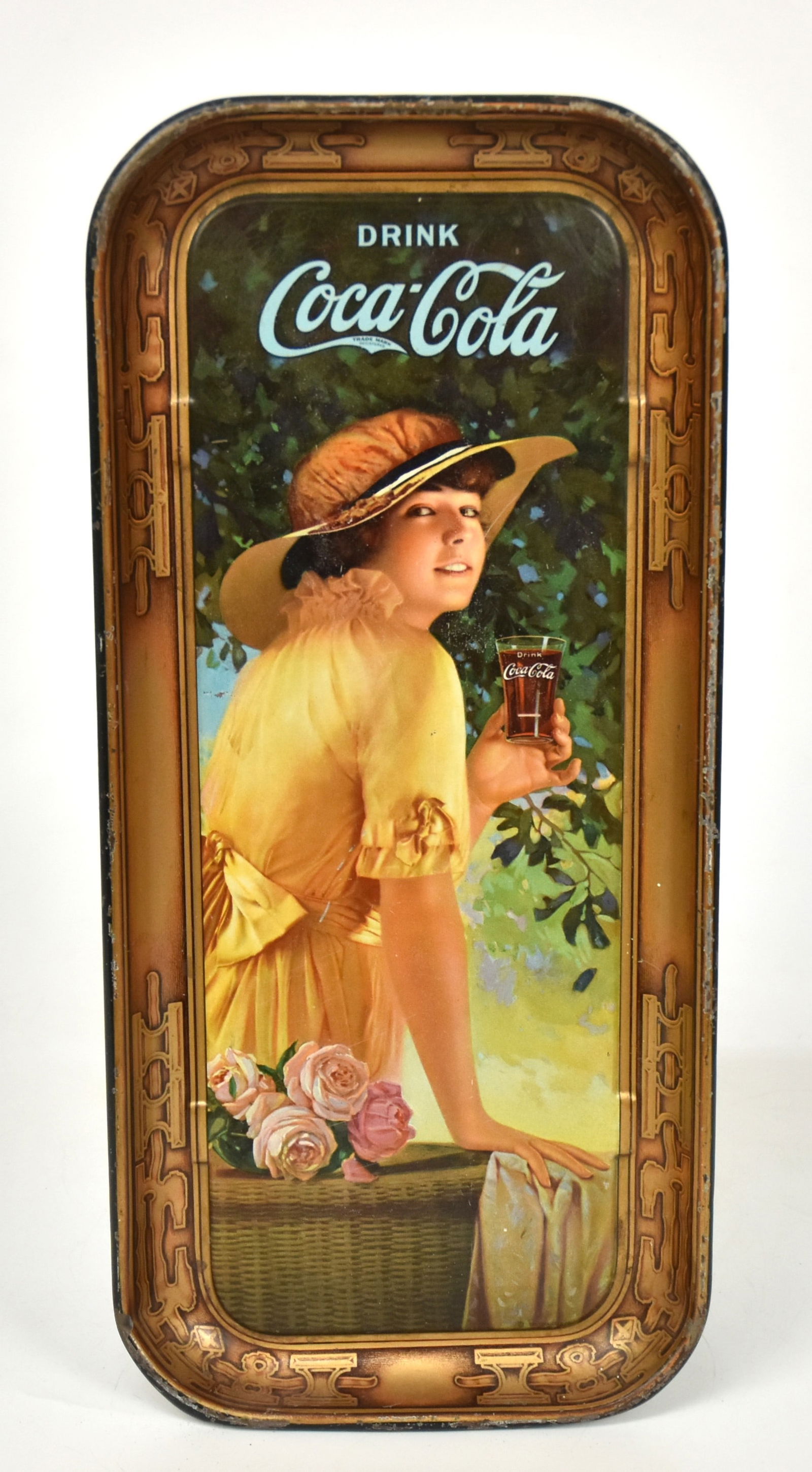 Original 1916 Oblong Coca Cola Tray: With lady holding glass. Some edge runs otherwise good condition. 18 1/2" x 8".