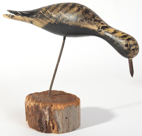 SHORE BIRD DECOY BY JIM SLACK: A nice painted wooden shore bird with red glass eyes on wood base signed Jim Slack, 12” x 9” high.