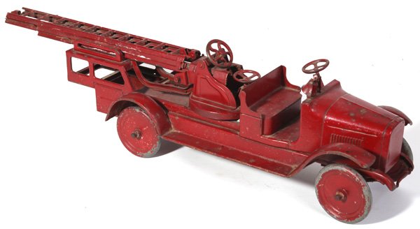 BUDDY L PRESSED STEEL FIRE LADDER TRUCK TOY: In old red repainted finish, circa 1920’s, 9” x 37” x 9” high.