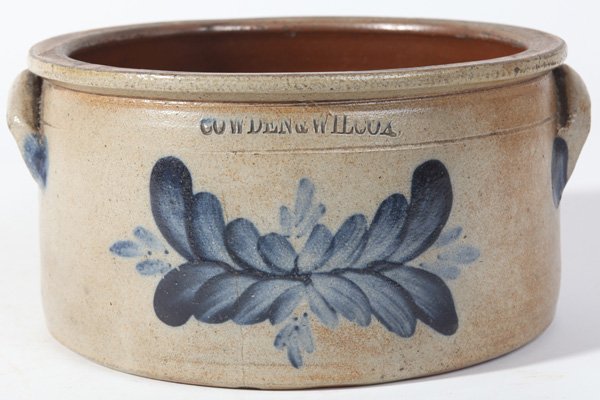 COWDEN & WILCOX BLUE DECORATED STONEWARE MILK PAN: With impressed “Cowden & Wilcox” under lip and fine painted cobalt laurel leaf below, paired half moon handles, also decorated with cobalt, 10” diameter x 5.25” high. John Cowden & Isaac Wilco