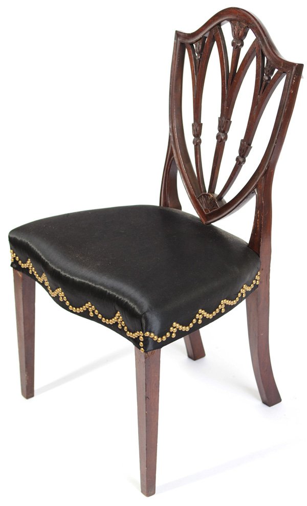 SAMUEL MCINTIRE ATTRIBUTION SHIELD BACK SIDE CHAIR: In mahogany, Attributed to Samuel McIntire Salem Mass, circa 1790 with carved shield back centering three pierced upright splats carved with leafage, above a serpentine seat on square tapered legs, se