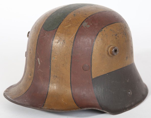 GERMAN WWI HELMET: In wonderful original early style cameo painted finish, original leather liner and chin strap and painted name of owner on inside reading “Mush. Noack”.