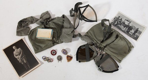 NAZI MEDALS AND PHOTOS: Lot of 8 or 10, including two different enameled Nazi party pins, an enameled silver pin from the 1936 Olympics and two other pins, one Nazi's and the other enameled silver. Lot includes two photo pos