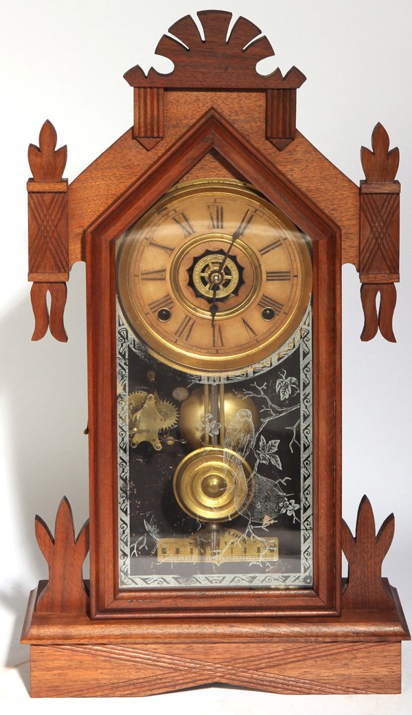 ANSONIA AMERICA KITCHEN CLOCK: In walnut case with original silver painted tablet with bird and spider web on branch, printed paper over tin dial with open escapement and stamped brass alarm wheel in center, brass time, strike & al