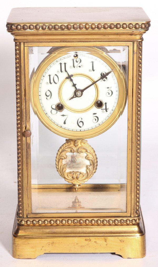 WATERBURY CHERBOURG CRYSTAL REGULATOR CLOCK: In gilt brass case with beveled glass doors and sides, unusual cast gilt brass pendulum with inset porcelain miniature of Dutch county scene with windmill. Enameled porcelain dial with gilt brass surr