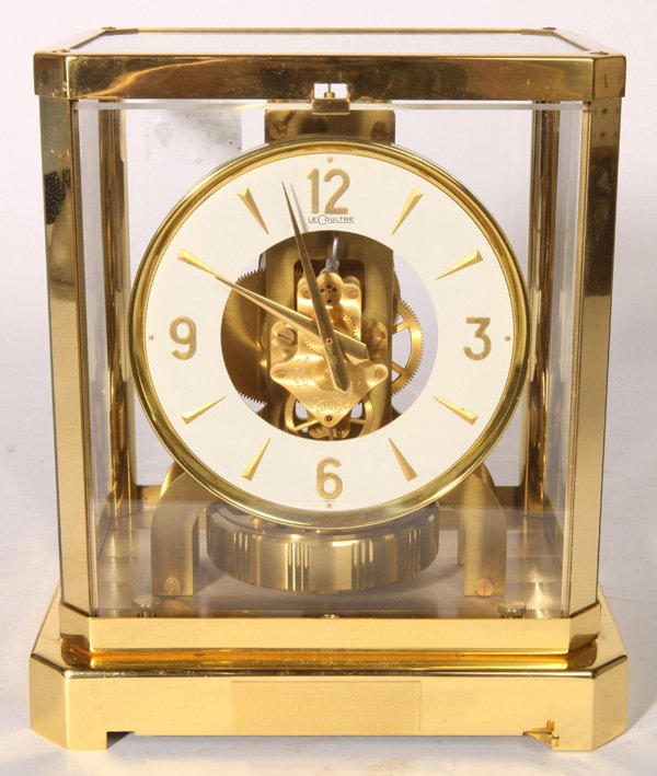 LECOULTRE ATMOS CLOCK: With enameled brass dial marked “LeCoultre.” Top of brass time only works marked ”LeCoultre Atmos 224978”. In original lacquered finish, with printed paper label on front of glass cover and ma