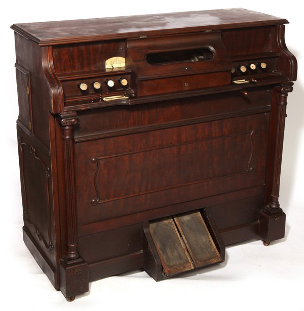 ANGELUS ORCHESTRAL PLAYER ORGAN BY WILCOX & WHITE: In rosewood case. With two 10" rolls. 40 1/2" high x 43 1/2" wide x 20" deep.