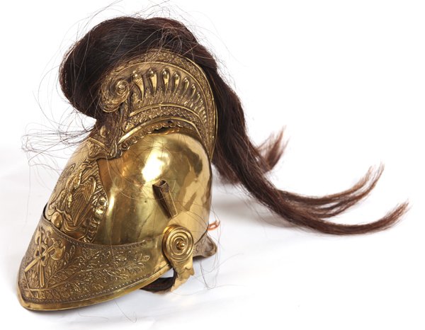 FRENCH FIREMAN'S HELMET: In embossed brass with flip-up visor and fish scale chin strap with horse hair crest. Embossed crest on front with eagle atop crossed arms with surrounding inscription “Sapeurs Pompifrs D' Asnieres.