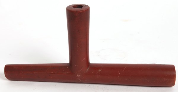NORTHERN PLAINS CATLINITE PIPE: This fine carved pipe tapers from hexagon to round with nice old patina, 9/15” long x 4.3” high.