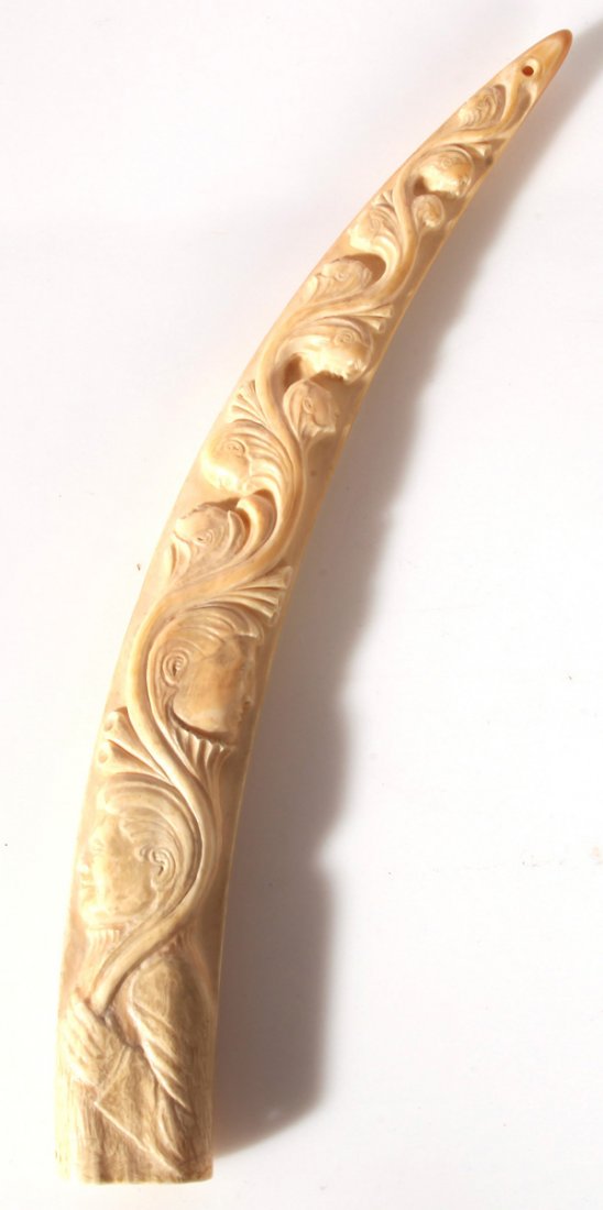 WWII SCRIMSHAW CARVED WALRUS TUSK: Carved on two side, one side having high relief carved U.S. warship under steam with smaller ship in background and WWII era military sea plane in sky along with two other smaller planes. The right si