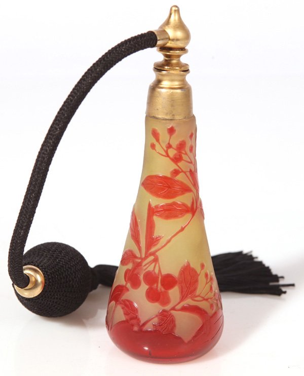 GALLE CAMEO GLASS PERFUME: With red cut o yellow decoration of branching berries with leaves, signed “Galle”on side, with gilt metal mounts and atomizer top, ground pontil base. The bottle is 4.25”high, total height with