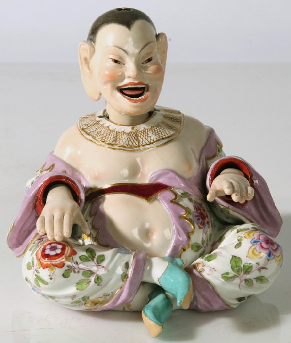 MEISSEN PORCELAIN NODDER OF CHINESE LAUGHING BUDDHA: 19th Century with moving hands, head and tongue. Marked with blue crossed swords mark on base and numbered 153. 5 1/2" high x 6" wide x 6" deep.