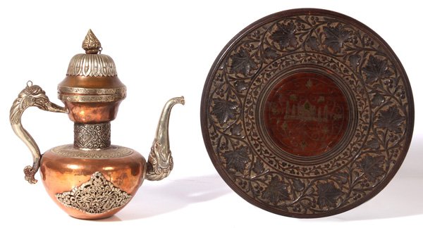 PERSIAN TRAY & COFFEE POT: Both circa early 20th century, includes a carved teak wood tray with brass inlay, 15”diameter, and a copper and nickel hand made coffee pot with figural handle and spout, 13”high
