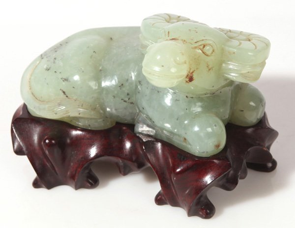 CHINESE JADE WATER BUFFALO: In reclining position on fitted teak stand, 5”long x 3.5”high.