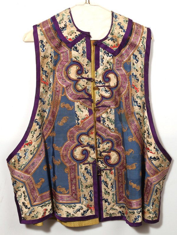 IMPERIAL CHINESE EMBROIDERED SILK VEST: With wonderfully embroidered bats in flight in polychrome silk and gilt on sky blue ground with purple trim and yellow liner with stamped brass buttons marked “Rich Treble Gilt” with Chinese chara