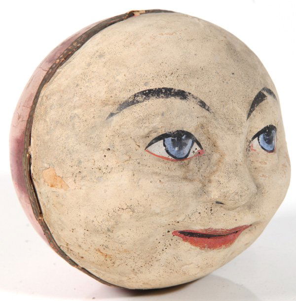 EARLY PAPER MACHE MAN OF THE MOON RATTLE: Circa 1900 with hand colored face. 3 1/2" high.