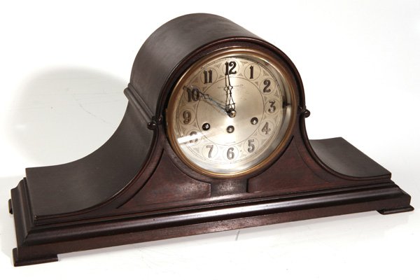 FRANK HERSCHEDE CINCINNATI SHELF CLOCK: Brass spring works with chimes in mahogany case. 9 1/2" high x 21 1/2" wide x 7" deep.