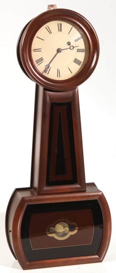 FINE COPY OF HOWARD BANJO CLOCK: In cherry case with nicely painted copies of Howard dial and tablets, brass time only weight driven movement, 12 x 4 x 29”high.