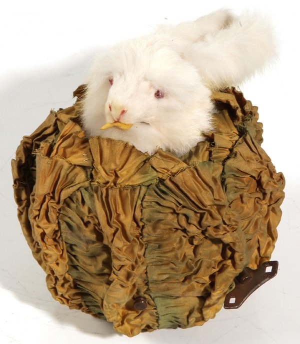 RABBIT IN CABBAGE MUSICAL AUTOMATON: Keywind mechanism that plays one tune as long eared rabbit raises his head and ears, turns head and open and closes his mouth before returning to original position. Probably by the French firm Roullet