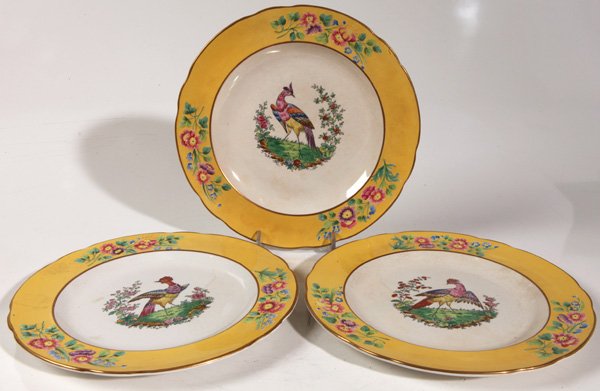COPELAND SPODE DINNER PLATES: Lot of 3 in the style of Meissen with hand colored birds in center, yellow border with polychrome painted relief flowers, marked with black transfer printed mark and impressed “Copeland” mark, 10.