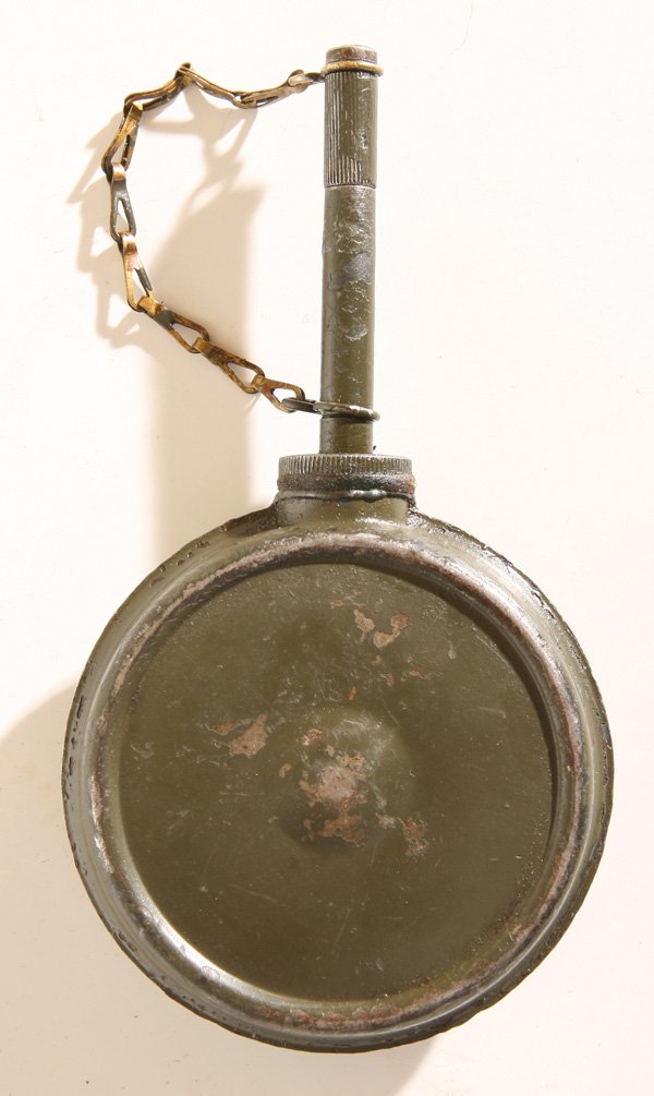 OILER FOR M1917 BROWNING WATER COOLED MACHINE GUN: This steel oiler in Army green paint is unmarked and has a brass chain attached to the screw lid and body of can, it is 6” high x 3.25” wide. The M1917 Browning machine gun is a heavy machine gun 