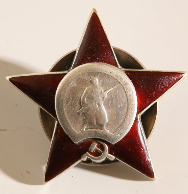 WWII SOVIET ORDER OF THE RED STAR MEDAL: A silver and red enameled WWII medal given to soldiers for bravery, similar to the U.S. Silver Star, this medal is 1.8” (46mm) diameter in the form of 5-pointed star in red enamel with armed soldier