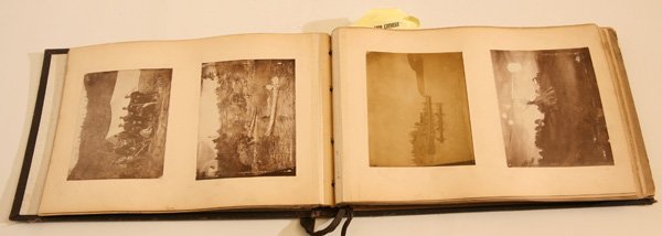 FINE AMERICAN EDWARDIAN PHOTO TRAVEL ALBUM: A circa 1900 photograph album in brown buckram boards with gilt embossed “Photographs” on cover with 58 early silver gelatin photographs mounted on heavy card stock pages. Most of these images are