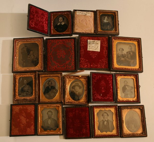 LARGE GROUP OF CASED PHOTOS: Lot of 11, including two sixth plates in full cases, one of which is by William Marratt, Danville, N.Y. and had his business card behind the daguerreotype portrait of a young couple identified as “C