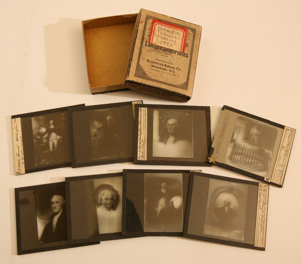 BOXED SET OF GLASS SLIDES OF PAINTING OF GEO.: This Box of Eastman Kodak Lantern Slide plates has nine 3.2 x 4.2” glass slides, each with a different famous painting of George Washington including several different portraits by Gilbert Stuart, C